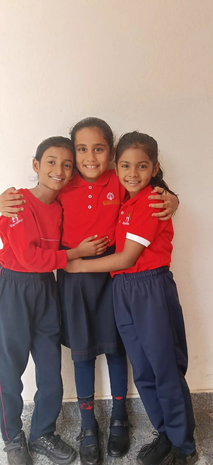 Students in school uniform together on campus